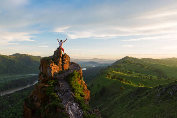 istock Man standing on top of cliff 1018088956