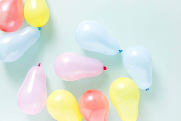 istock Set different colorful balloons pastel background flat lay top view 1018091562