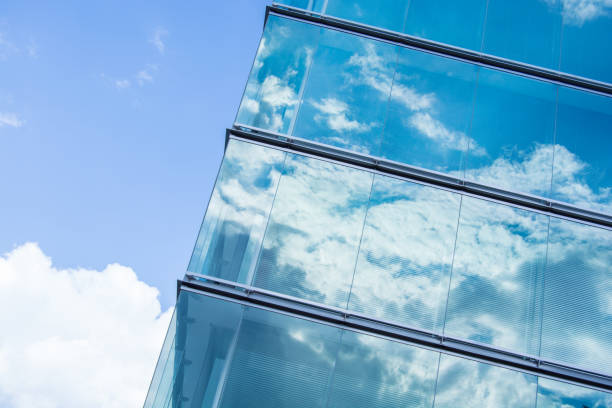 istock Reflection of sky and clouds in windows 1018092130
