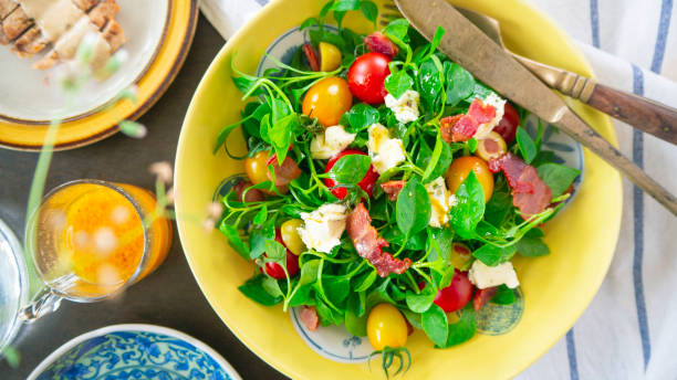 Knife and Fork on watercress salad dish OLYMPUS DIGITAL CAMERA watercress stock pictures, royalty-free photos & images