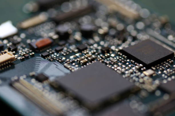 istock Electronics background technology close up of the green kit circuit board. 1018099154