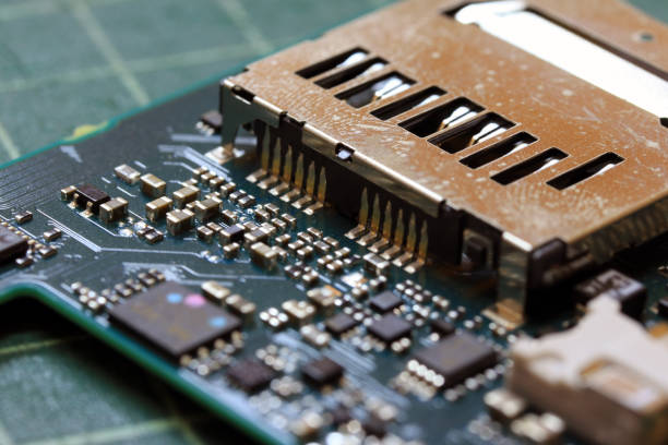 istock Electronics background technology close up of the green kit circuit board. 1018099170