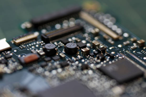 istock Electronics background technology close up of the green kit circuit board. 1018099178