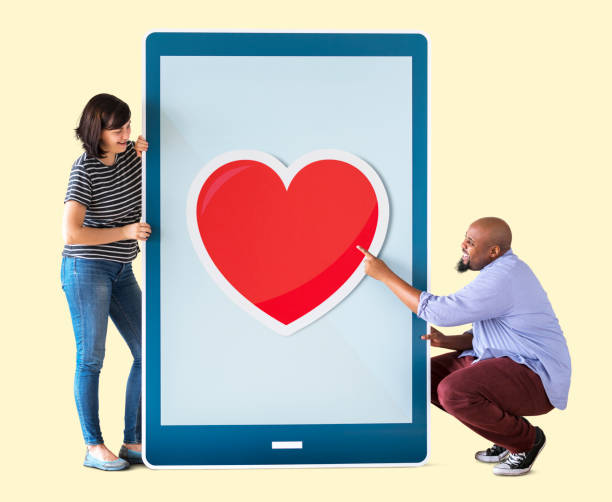 istock Diverse couple of people holding a tablet 1018099338