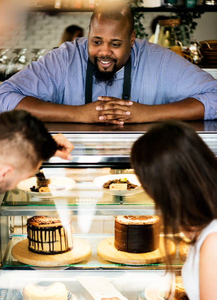 istock Customers choosing cake at the display fridge 1018102140
