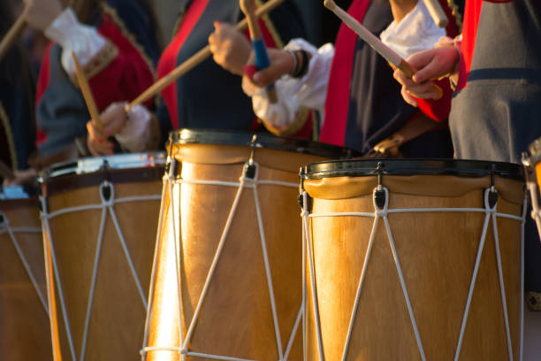 istock Group of Men Dressed in Medieval Clothes Playing Drums in Italy 1018103586