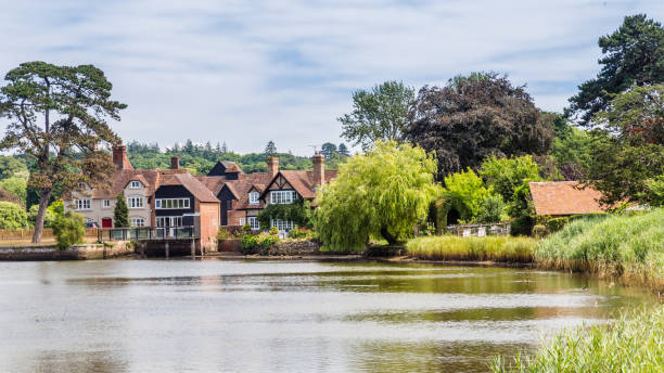 Beaulieu village and river in the New forest area of Hampshire i View on the beatiful historic Beaulieu village and river in the New forest area of Hampshire in England, United Kingdom fish village stock pictures, royalty-free photos & images