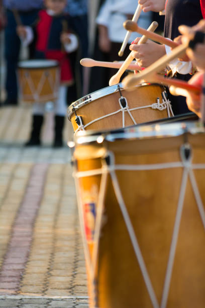 istock Group of Men Dressed in Medieval Clothes Playing Drums in Italy 1018110614