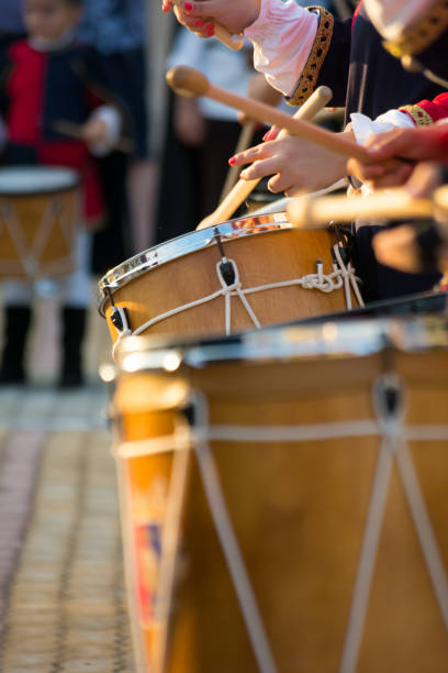 istock Group of Men Dressed in Medieval Clothes Playing Drums in Italy 1018111170
