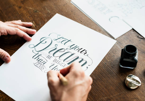 istock Closeup of a calligrapher working on a project 1018111230
