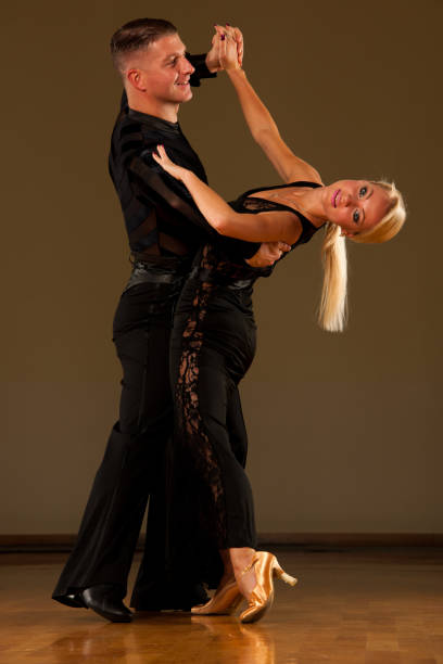 istock Beautiful ballroom  couple preforms their exhibition dance 1018113436