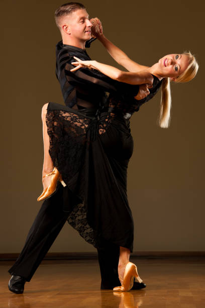 istock Beautiful ballroom  couple preforms their exhibition dance 1018113464