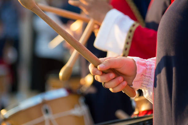istock Group of Men Dressed in Medieval Clothes Playing Drums in Italy 1018117848
