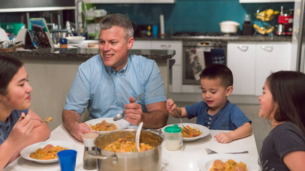 istock A father enjoying dinner with his children 1018126768