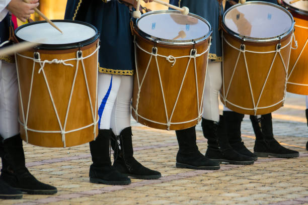 istock Group of Men Dressed in Medieval Clothes Playing Drums in Italy 1018126904