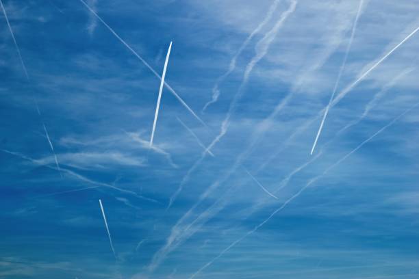istock Blue sky with many crossing contrails 1018130634