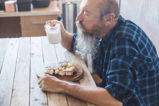 istock Middle aged man eating breakfast - borek, asian cuisine 1018130894