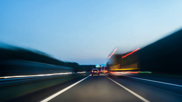 istock Highway at night with light streaks 1018133666