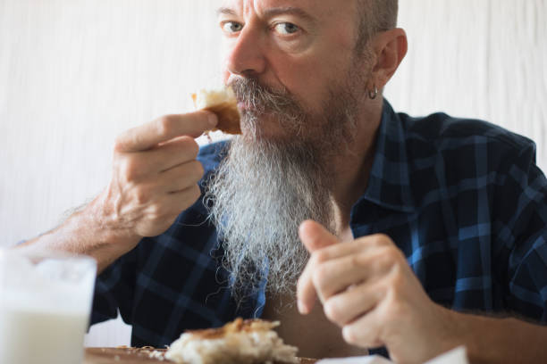 istock Middle aged man eating breakfast - borek, asian cuisine 1018133672