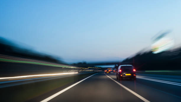 istock Highway at night with light streaks 1018133686