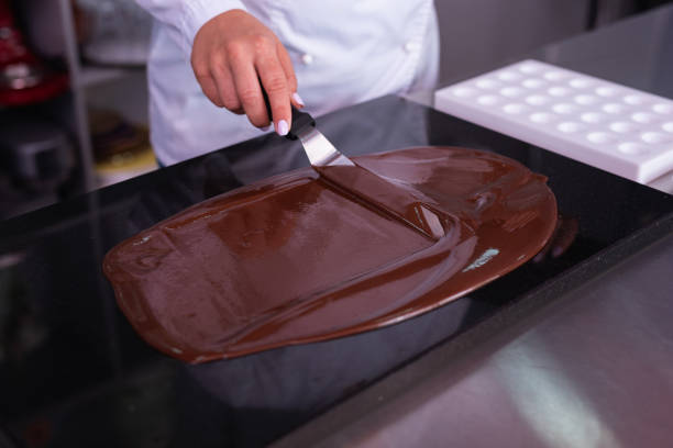 istock Professional chef with white nail art making chocolate 1018134674