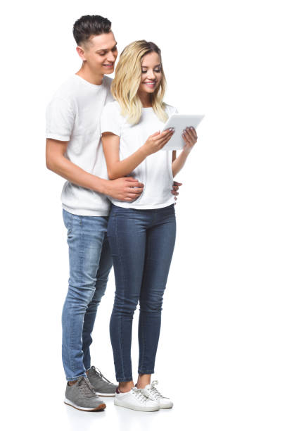 istock happy couple using tablet together isolated on white 1018142354