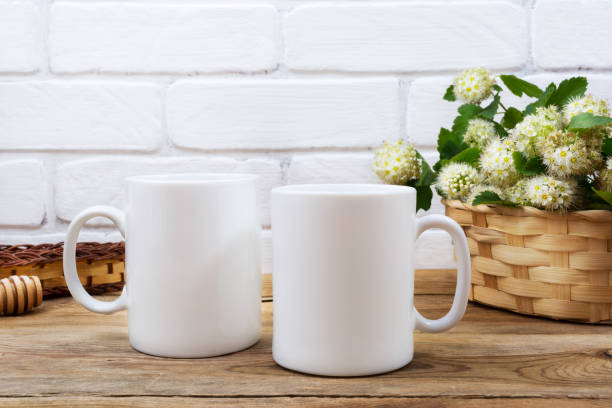 istock Two coffee mug mockup with basket of flowers 1018143412