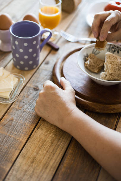 istock Breakfast at dining table - boiled eggs, mortadella, soft cheese, yogurt and fruit juice 1018151734