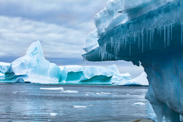 global warming and climate change concept, iceberg melting in Antarctica stock photo