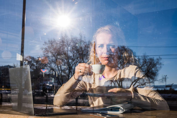 istock Busy woman drinking coffee and looking at camera. 1018158866
