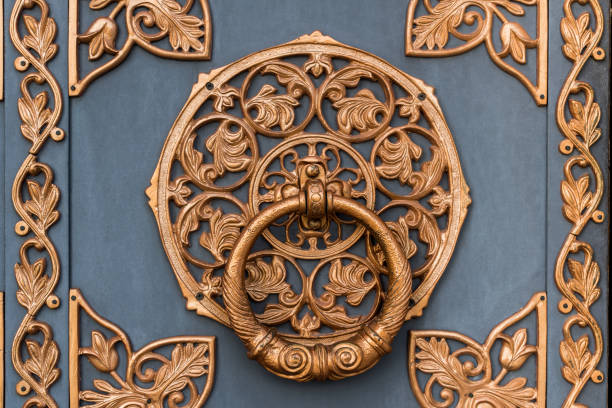 istock Metal door decorated with bronze ornament 1018159660