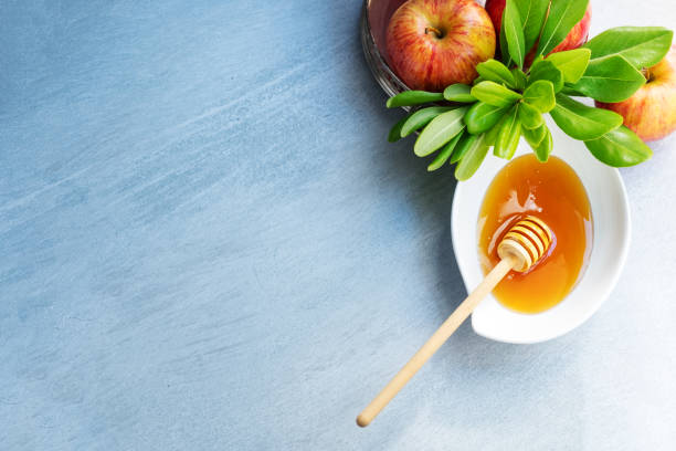 istock Apples, pomegranate and honey for Rosh Hashanah 1018159714