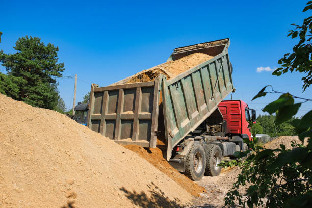 rusovich pours sand on the construction site