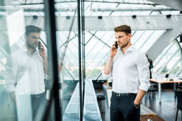 istock Businessman making a phone call in the office 1018169452