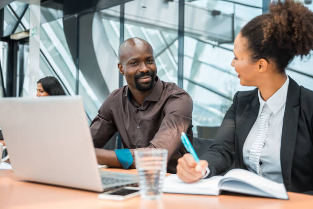 istock Colleagues talking about new business ideas in the office 1018171674