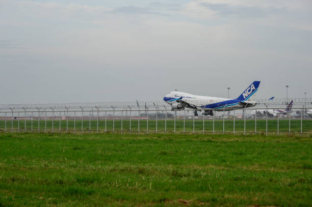 Nippon Cargo Airlines Plane landing to runways at suvarnabhumi international airport in Bangkok ,Thailand. Bangkok, Thailand - July 30, 2017: Nippon Cargo Airlines Plane landing to runways at suvarnabhumi international airport in Bangkok ,Thailand. This airport is one of the most populated airports in the world. nippon cargo airlines photos stock pictures, royalty-free photos & images