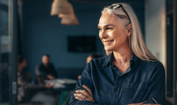 istock Female entrepreneur standing in office 1018188122