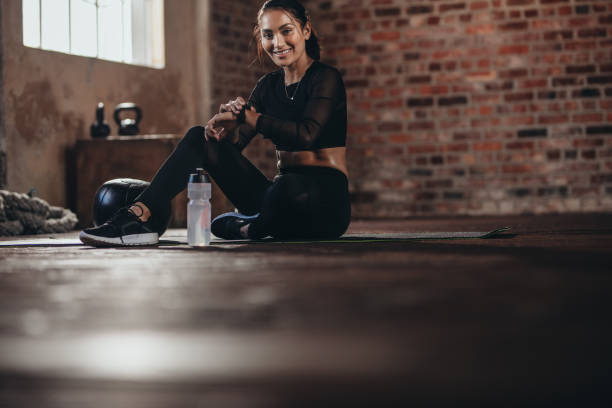 istock Monitoring her fitness performance on smartwatch 1018192808