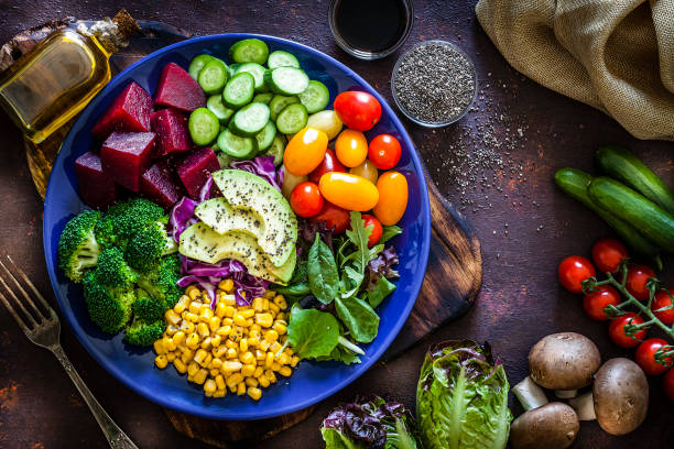 istock Salad mix plate shot from above on dark brown table 1018199018
