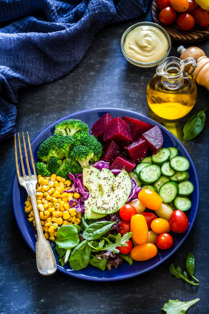 istock Salad mix plate shot from above on dark table 1018199126