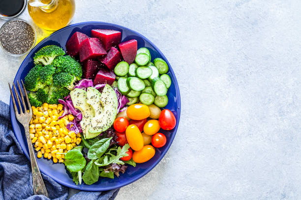istock Salad mix plate shot from above on light gray marble table 1018199272