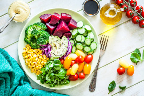 istock Salad mix plate shot from above on light green picnic table 1018199544