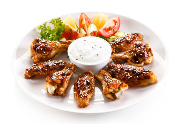 istock Chicken wings and vegetables 1018203282