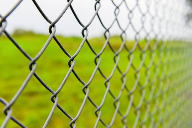 istock Steel fence around the field 1018207316