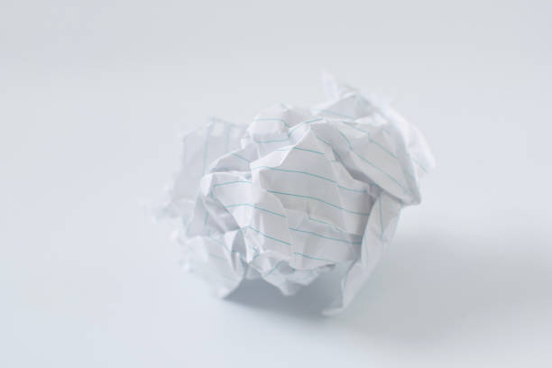 istock Scrunched paper ball on the white background, close up 1018211040