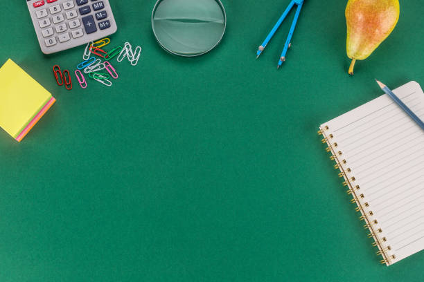 istock School supplies with copy space on green background. 1018213880