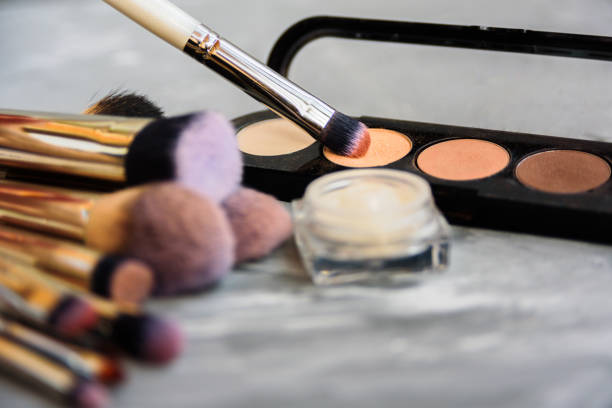 istock Set of makeup brushes on grey background 1018219334