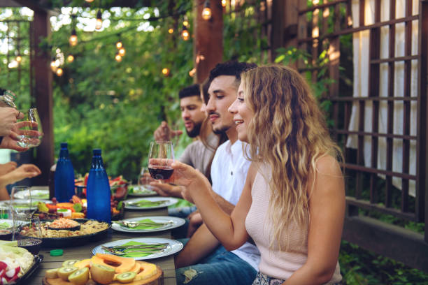 istock Multi-ethnic friends enjoying dinner together 1018226090