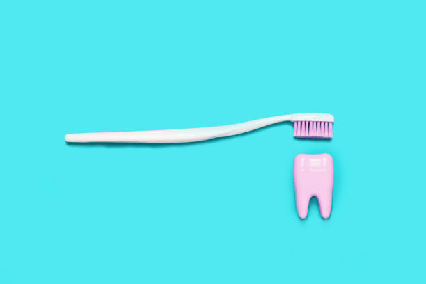 istock Big teeth on blue and pink background. Minimal 1018232674