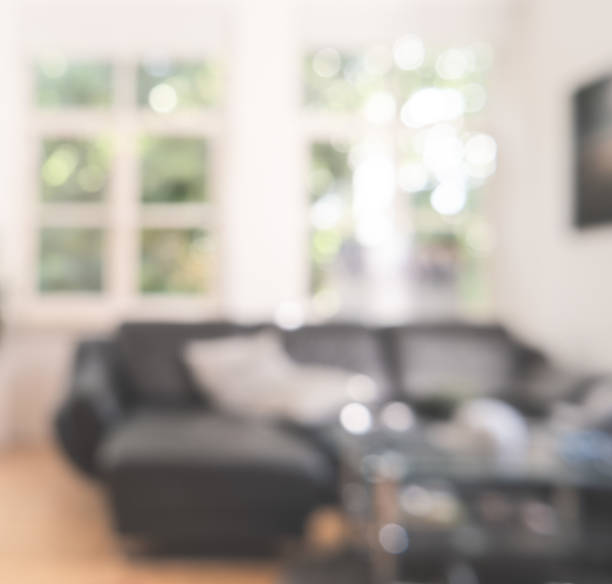 istock Blurred Living room with great windows in an old building 1018237474